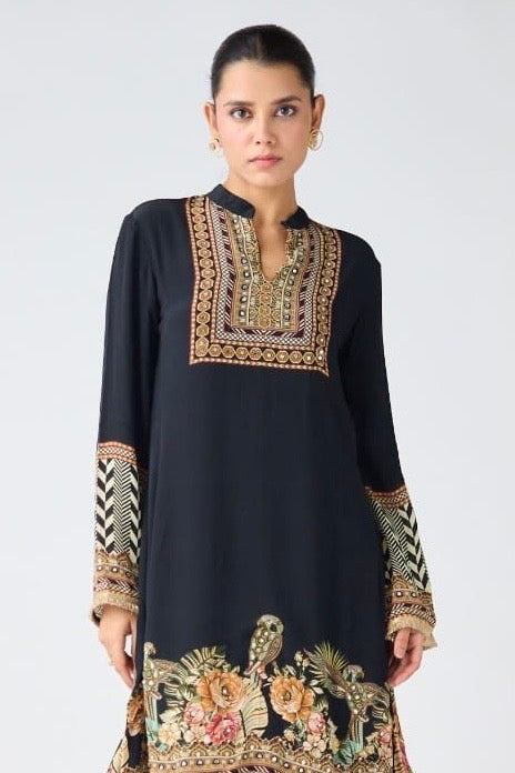 Shop black crepe printed kurta with dhoti salwar online in USA. Shop the best and latest designs in embroidered sarees, designer sarees, Anarkali suit, lehengas, sharara suits, kaftans for weddings and special occasions from Pure Elegance Indian fashion store in USA.-closeup