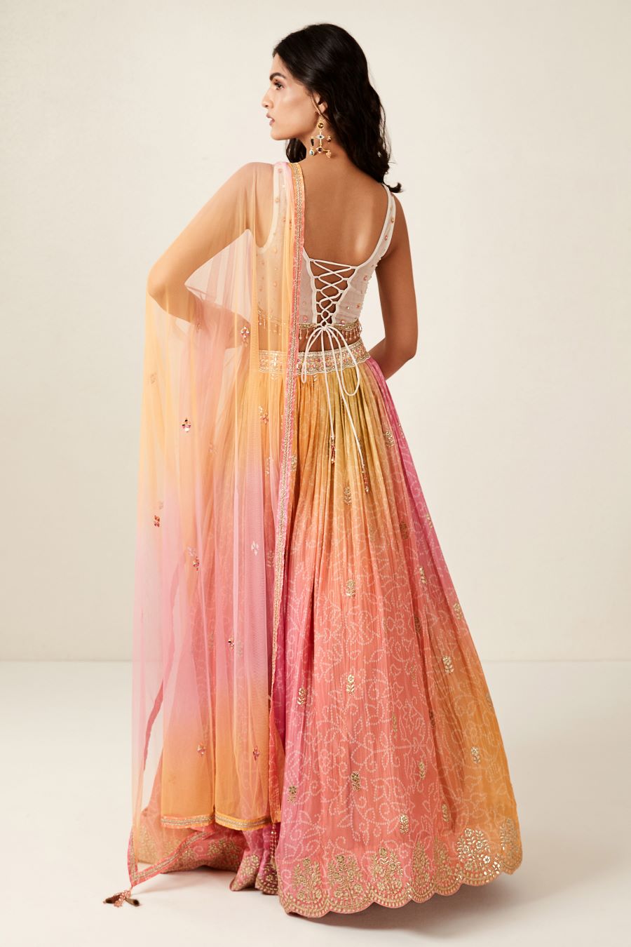 Buy pink tie and dye lehenga online in USA with dupatta. Shop designer lehengas, designer sarees, bridesmaids lehengas, designer salwar suits, wedding lehengas, wedding sarees in USA from Pure Elegance Indian fashion clothing store.-back