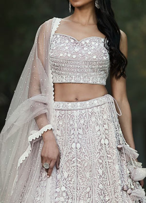 Buy lilac thread and mirror work silk lehenga online in USA with dupatta. Shop designer lehengas, designer sarees, bridesmaids lehengas, designer salwar suits, wedding lehengas, wedding sarees in USA from Pure Elegance Indian fashion clothing store.-closeup