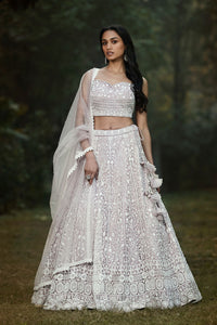 Buy lilac thread and mirror work silk lehenga online in USA with dupatta. Shop designer lehengas, designer sarees, bridesmaids lehengas, designer salwar suits, wedding lehengas, wedding sarees in USA from Pure Elegance Indian fashion clothing store.-full view