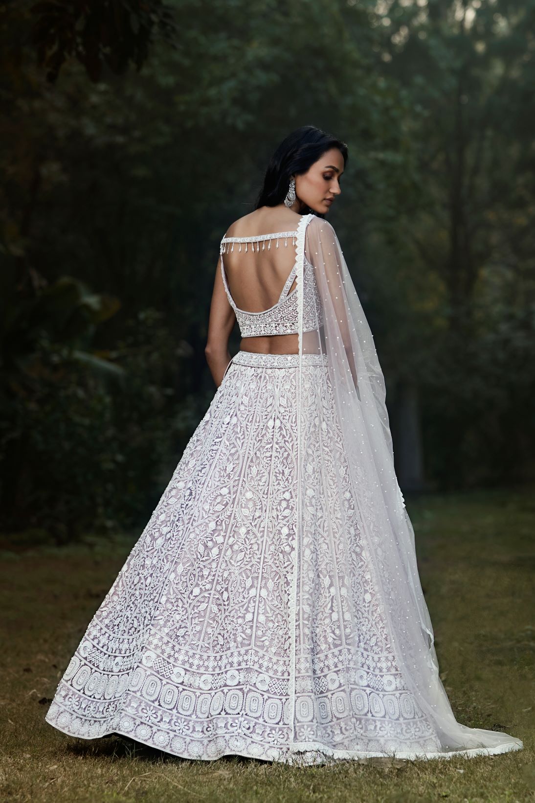 Buy lilac thread and mirror work silk lehenga online in USA with dupatta. Shop designer lehengas, designer sarees, bridesmaids lehengas, designer salwar suits, wedding lehengas, wedding sarees in USA from Pure Elegance Indian fashion clothing store.-back
