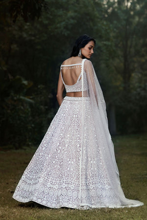 Buy lilac thread and mirror work silk lehenga online in USA with dupatta. Shop designer lehengas, designer sarees, bridesmaids lehengas, designer salwar suits, wedding lehengas, wedding sarees in USA from Pure Elegance Indian fashion clothing store.-back