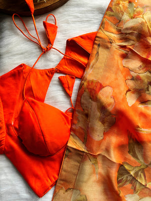 Shop beautiful orange floral shimmer georgette saree online in USA with blouse. Look your best on festive occasions in latest designer saris, pure silk saris, Kanjivaram silk sarees, handwoven saris, tussar silk sarees, linen sarees,  summer sarees from Pure Elegance Indian clothing store in USA.-closeup