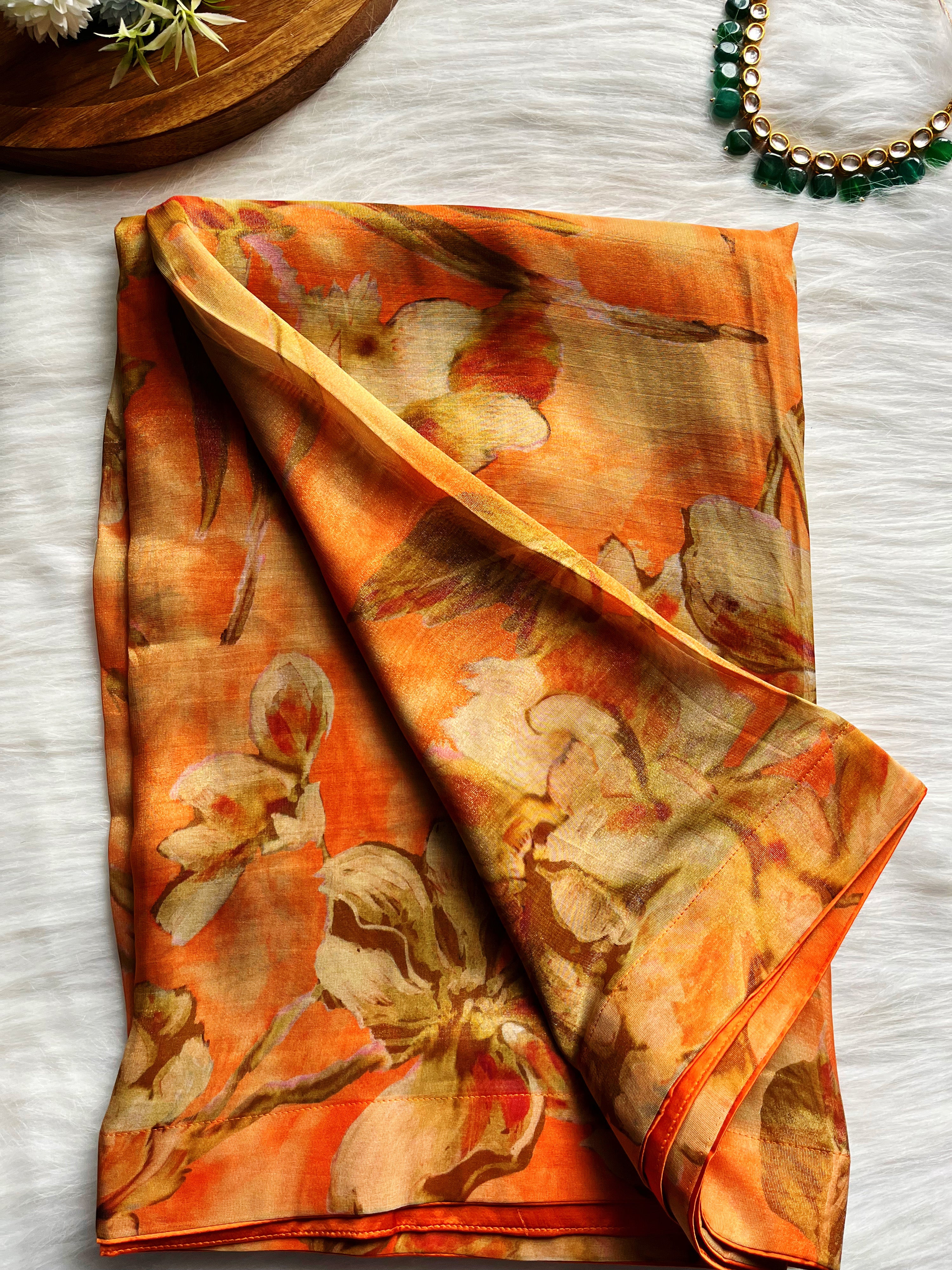 Shop beautiful orange floral shimmer georgette saree online in USA with blouse. Look your best on festive occasions in latest designer saris, pure silk saris, Kanjivaram silk sarees, handwoven saris, tussar silk sarees, linen sarees,  summer sarees from Pure Elegance Indian clothing store in USA.-saree