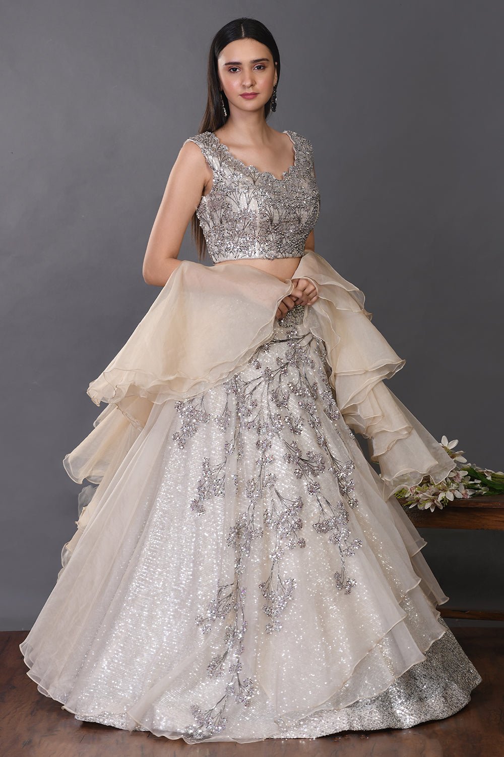 Shop beautiful off-white organza lehenga online in USA with ruffle dupatta. Get festive ready in beautiful designer Anarkali suits, designer lehenga, wedding gowns, sharara suits, designer sarees from Pure Elegance Indian fashion store in USA.-side