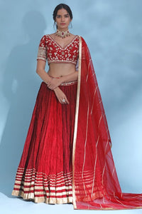 Shop stunning red gota work designer lehenga online in USA with dupatta. Look your best at weddings and parties in Indian dresses, designer lehengas, Anarkali suits, designer gowns, salwar suits, sharara suits from Pure Elegance Indian fashion store in USA.-full view