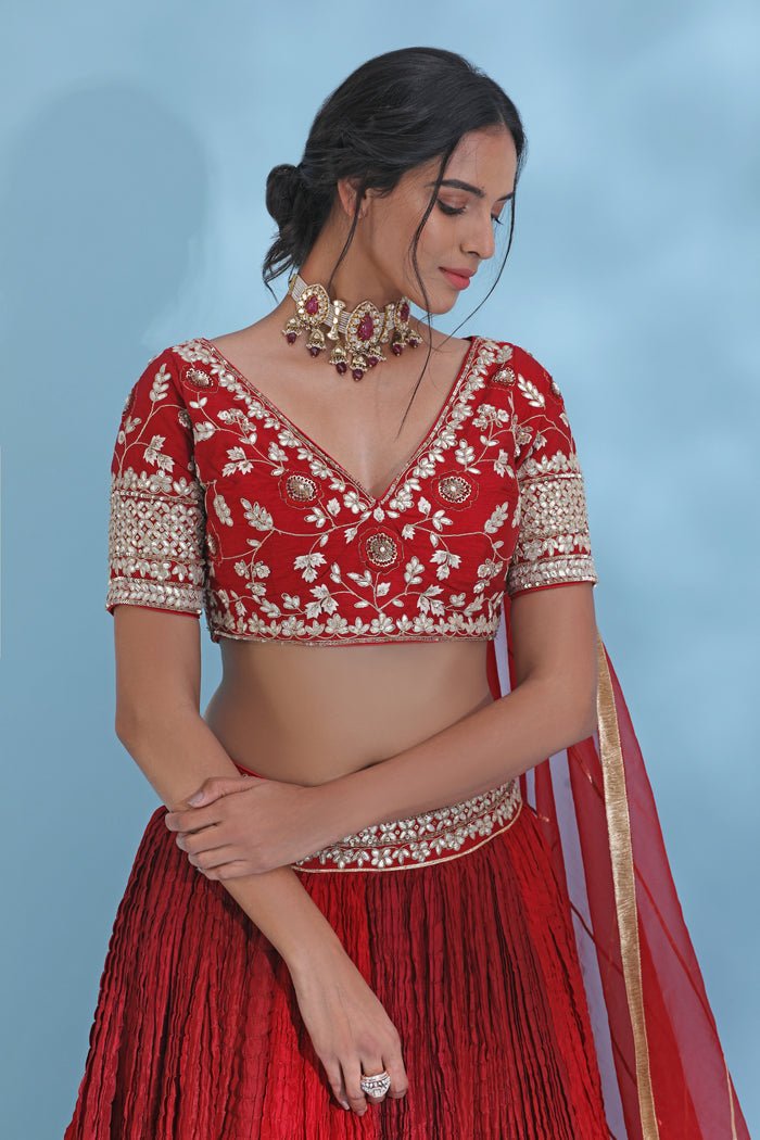 Shop stunning red gota work designer lehenga online in USA with dupatta. Look your best at weddings and parties in Indian dresses, designer lehengas, Anarkali suits, designer gowns, salwar suits, sharara suits from Pure Elegance Indian fashion store in USA.-closeup