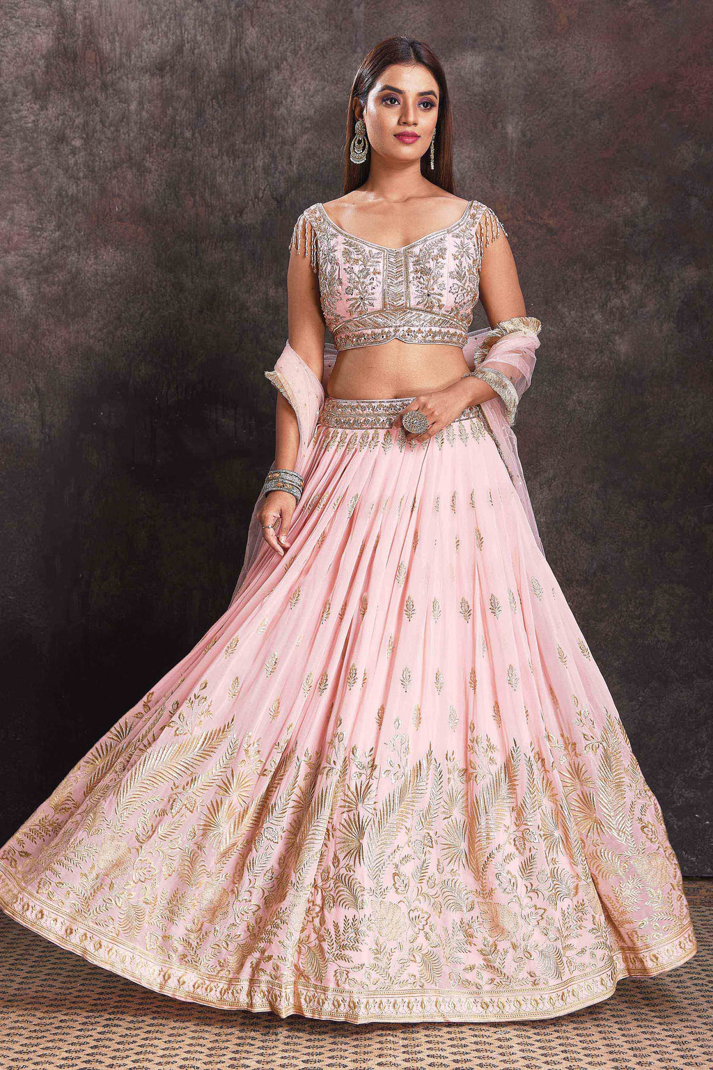 Buy powder pink embroidered designer lehenga online in USA with dupatta. Look your ethnic best on festive occasions with latest designer sarees, pure silk sarees, Kanchipuram silk sarees, designer dresses, Anarkali suits, gown, embroidered sarees from Pure Elegance Indian fashion store in USA.-full view