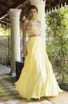 Shop beautiful light yellow halter neck lehenga online in USA with ruffle dupatta. Dazzle on weddings and special occasions with exquisite Indian designer dresses, sharara suits, Anarkali suits, wedding lehengas from Pure Elegance Indian fashion store in USA.-full view