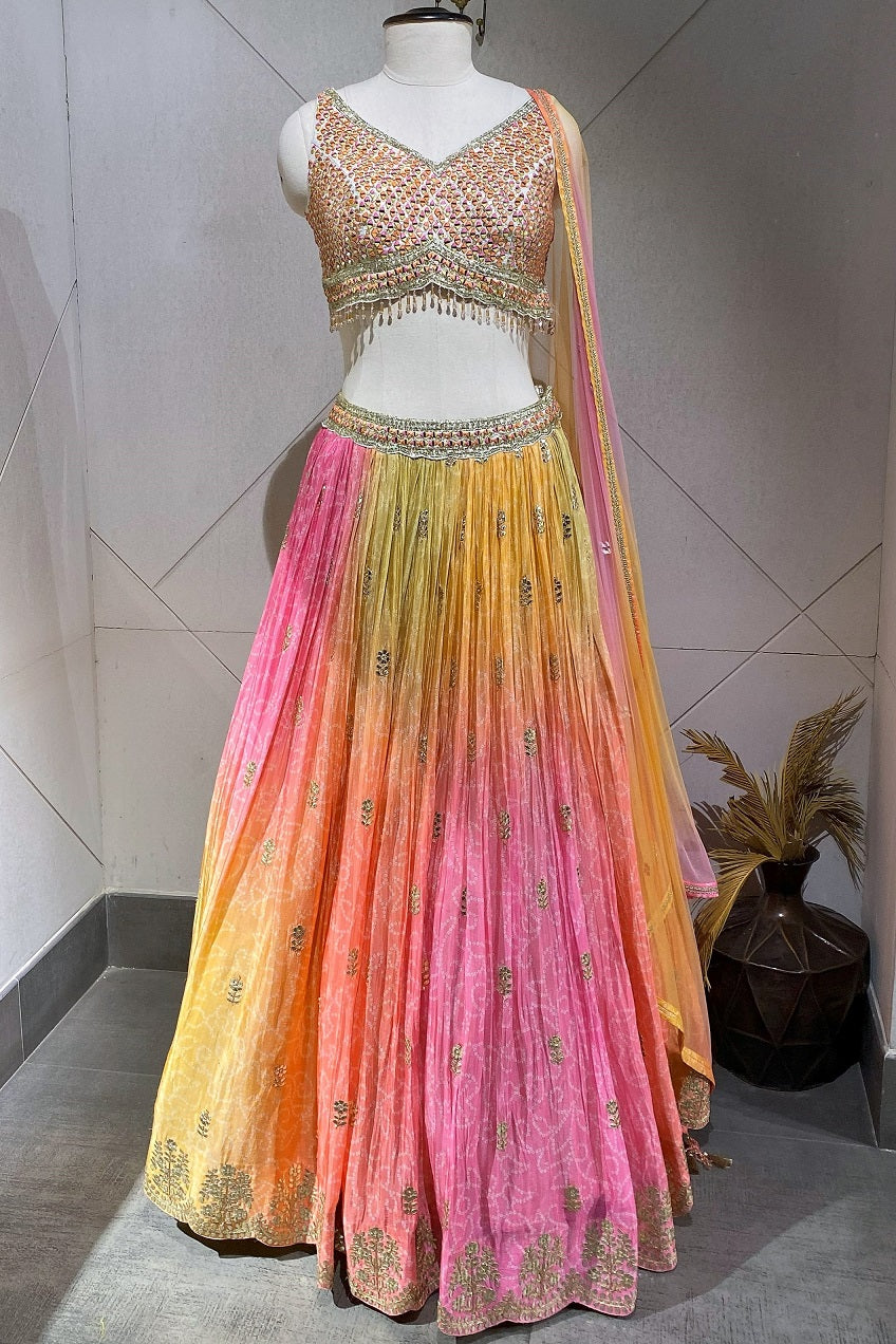 Buy a Beautiful multicolor lehenga with a net dupatta. The lehenga is perfect for mehandi and sangeet parties. It is crafted in Georgette with metallic 3D work on the blouse. Shop online from Pure Elegance. - Full view