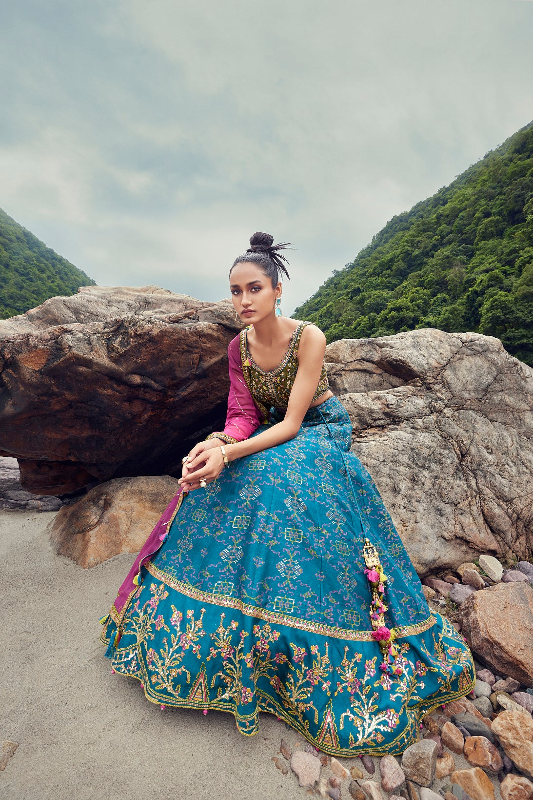 Photo of Navy blue velvet lehenga with pink dupatta and embroidery