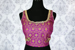 Buy purple embroidered sleeveless saree blouse online in USA. Pure Elegance Indian clothing store brings an exquisite range of readymade saree blouses in USA to match your gorgeous Indian saris. Add spark to your ethnic look with stylish sari blouses for weddings and parties.-front