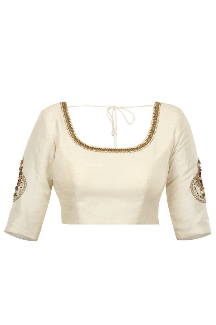 Buy off-white raw silk saree blouse with embroidered sleeves online in USA. Match your designer sarees with stylish readymade saree blouses available at Pure Elegance clothing store in USA or shop online.-front