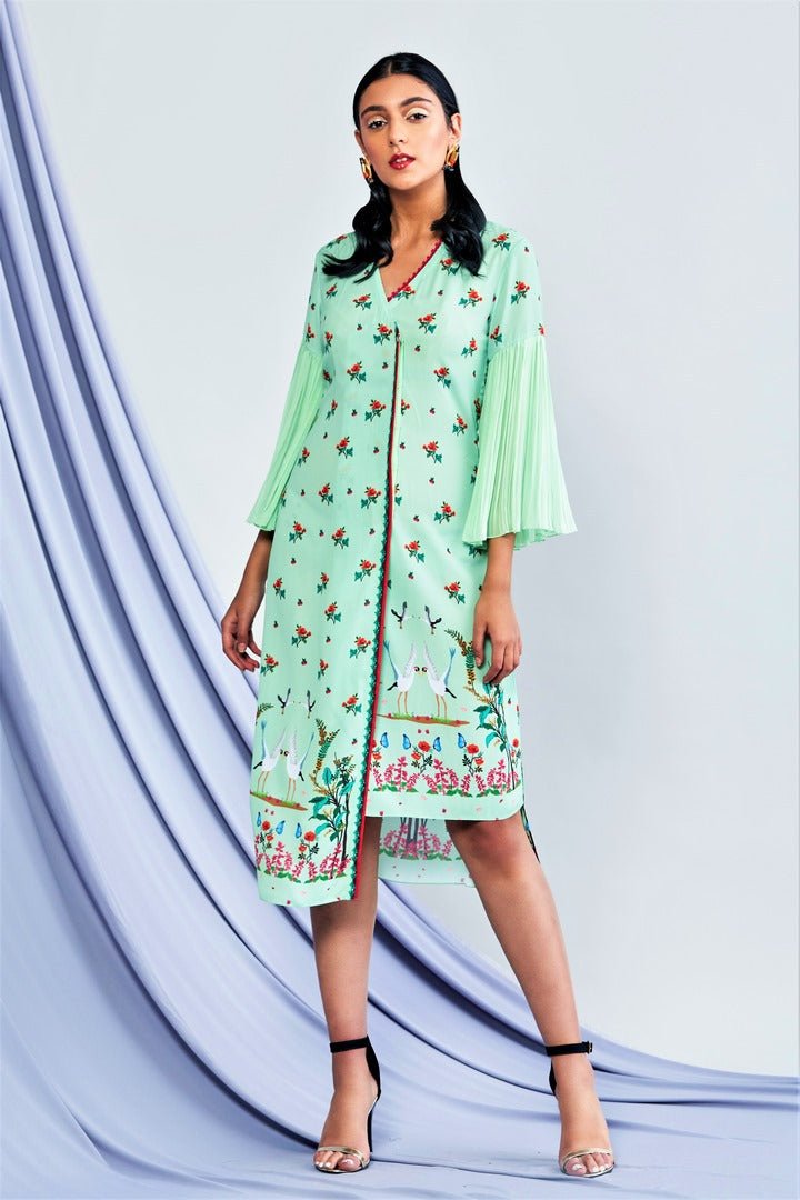 Shop sea green asymmetric printed tunic dress with flared sleeves online in USA. Elevate your Indian style with a range of exclusive Indian designer dresses from Pure Elegance clothing store in USA. We have an exquisite collection of Indian saris, suits, Anarkalis, lehengas for Indian women living in USA. Shop now.-full view