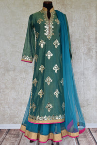 500867-Buy this ethnic Indian green suit with fancy band collar glass applique blue and fuchsia trim online or from our Pure Elegance store in USA. Perfect for wedding. Front View.