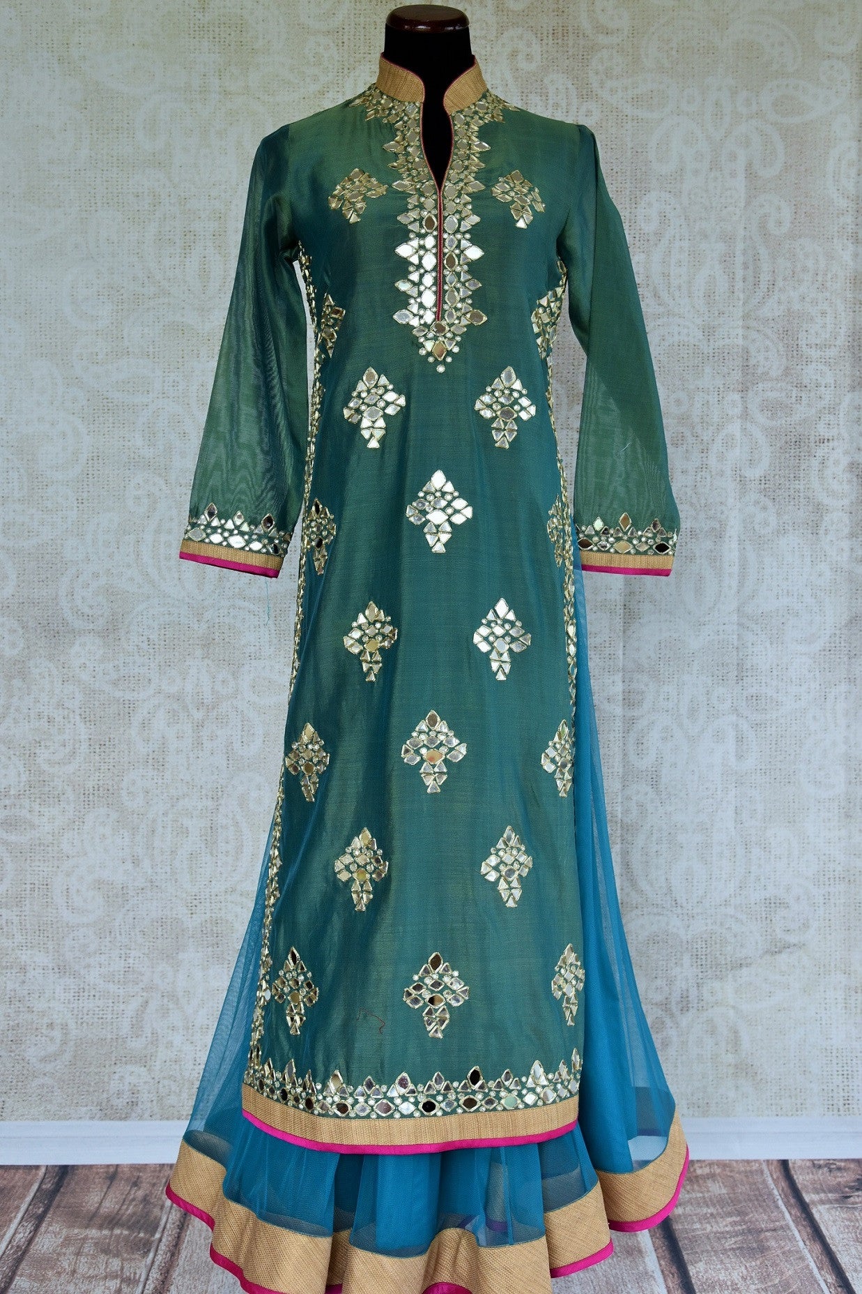 500867 Buy this ethnic Indian green suit with fancy band collar glass applique blue and fuchsia trim online or from our Pure Elegance store in USA. Perfect for wedding. Front View.