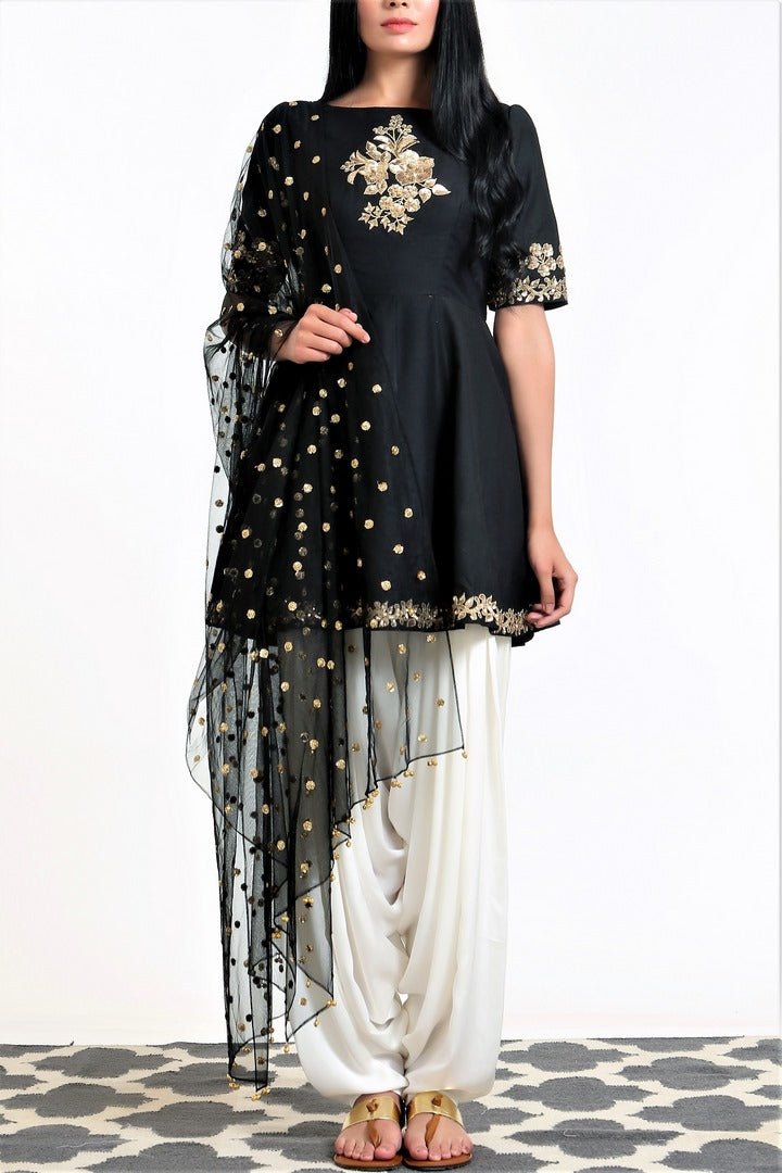 Buy black peplum silk blend kurta with white dhoti salwar and net dupatta online in USA. Get occasion ready with a stunning range of Indian designer suits from Pure Elegance fashion store in USA. We bring the best designer dresses for Indian women in USA at our online store. Shop now.-full view