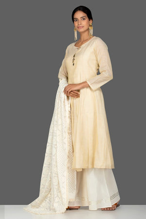 Buy lovely cream tissue chanderi suit online in USA with dupatta. Be an epitome of Indian fashion with a premium range of designer suits, Anarkali dresses from Pure Elegance luxury Indian fashion store in USA. Buy online now.-side