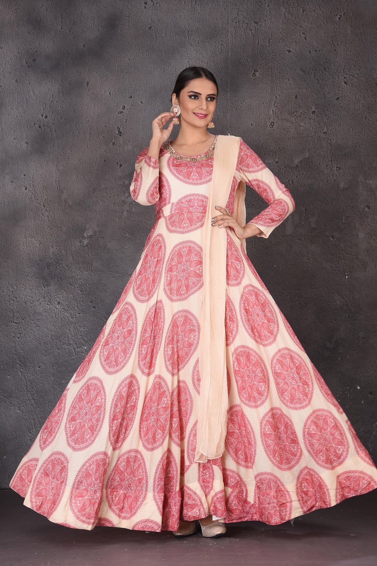 Shop stunning cream printed embroidered floorlength Anarkali online in USA with dupatta. Look elegant at weddings and festive occasions in exclusive designer suits, designer gowns, Anarkali suits, sharara suits, wedding gowns, palazzo suits, designer lehenga from Pure Elegance Indian clothing store in USA.-full view