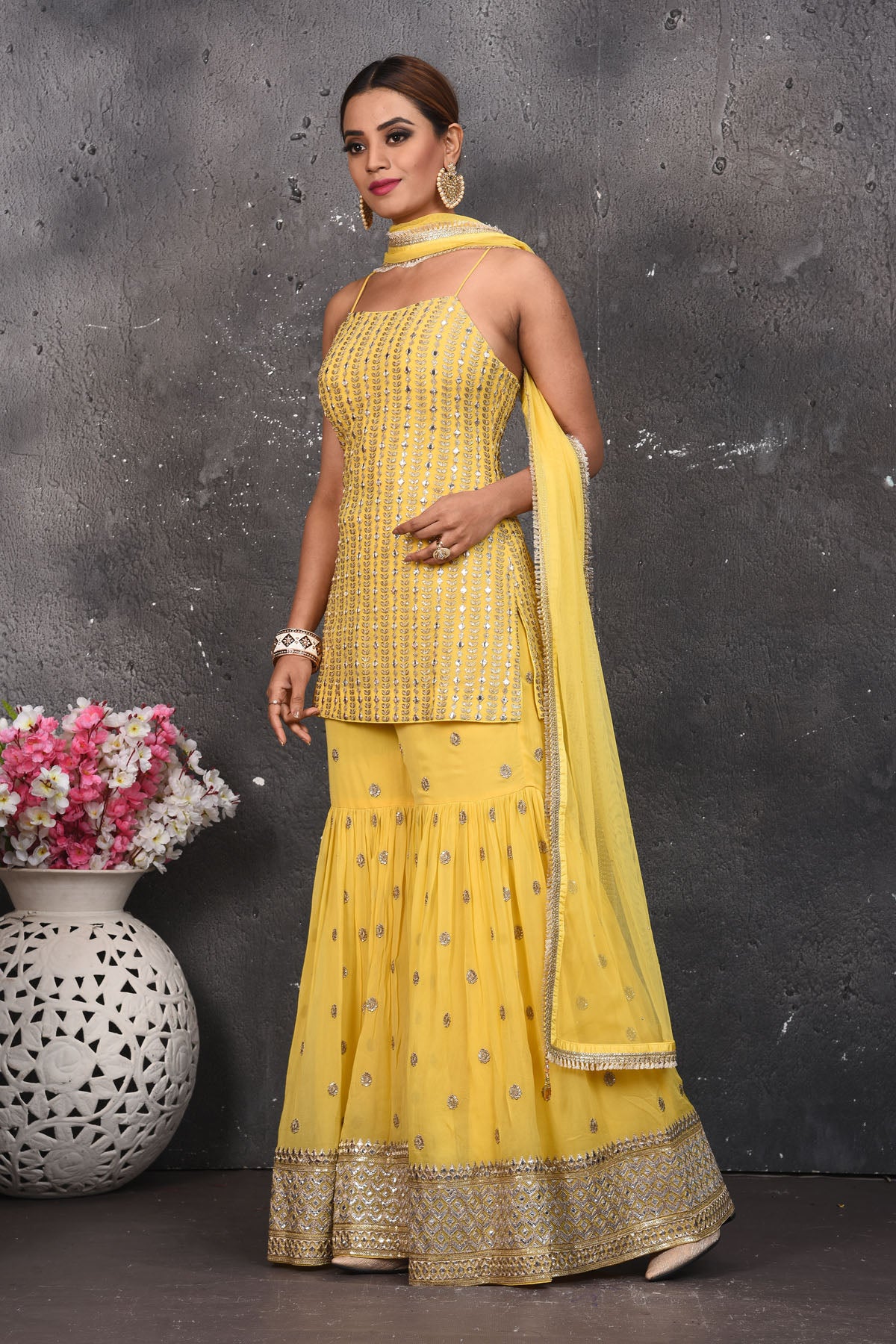 Shop beautiful light yellow embroidered designer gharara suit online in USA with dupatta. Look your best at weddings and special occasions in exclusive designer lehengas, Anarkali suits, sharara suits. designer gowns and Indian dresses from Pure Elegance Indian fashion store in USA.-side