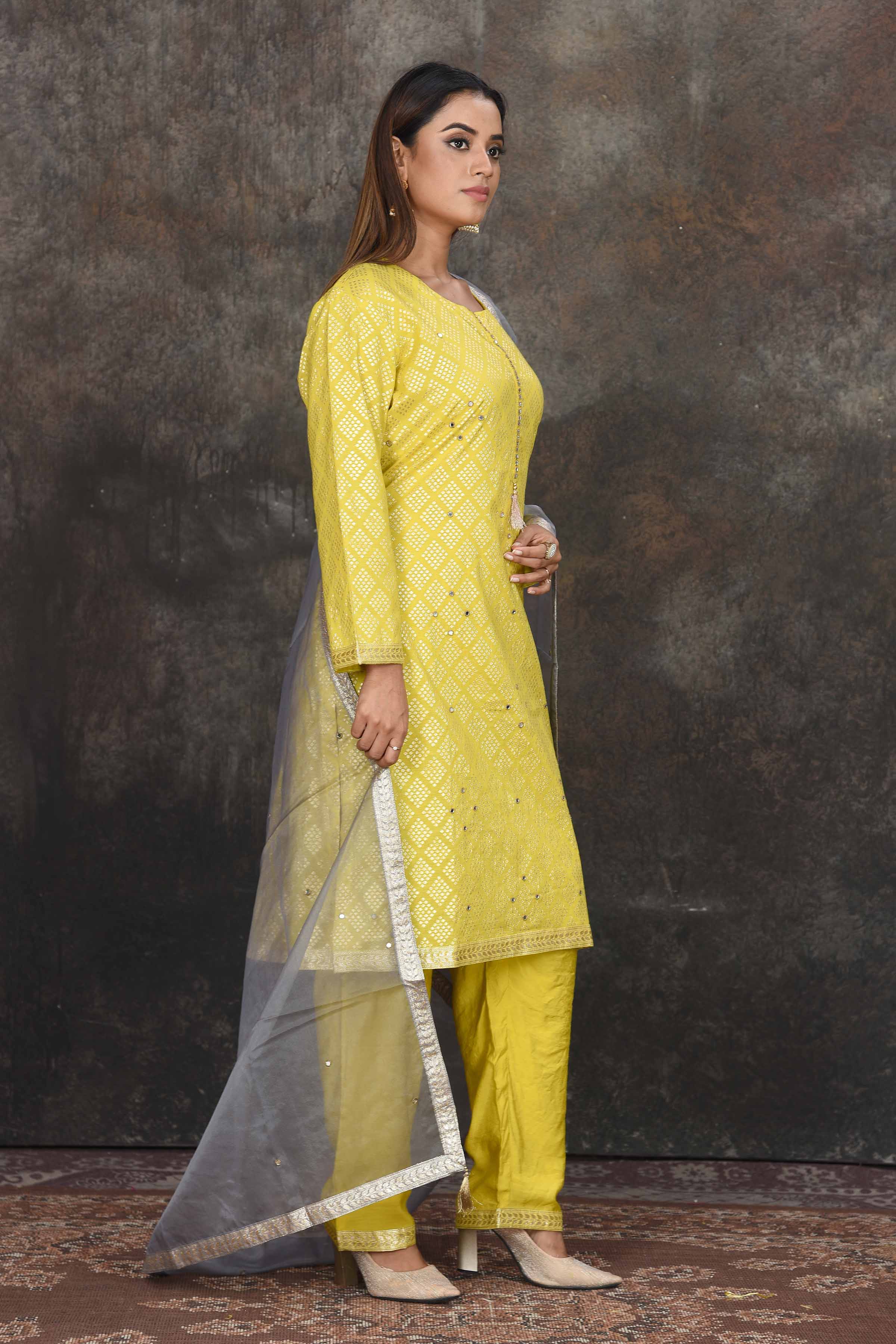 Buy stunning light yellow palazzo suit online in USA with grey dupatta. Dazzle at sangeet and wedding occasions in this beautiful designer lehengas, Anarkali suits, sharara suit, bridal gowns, bridal lehengas from Pure Elegance Indian fashion store in USA.-right