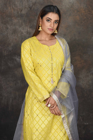 Buy stunning light yellow palazzo suit online in USA with grey dupatta. Dazzle at sangeet and wedding occasions in this beautiful designer lehengas, Anarkali suits, sharara suit, bridal gowns, bridal lehengas from Pure Elegance Indian fashion store in USA.-closeup