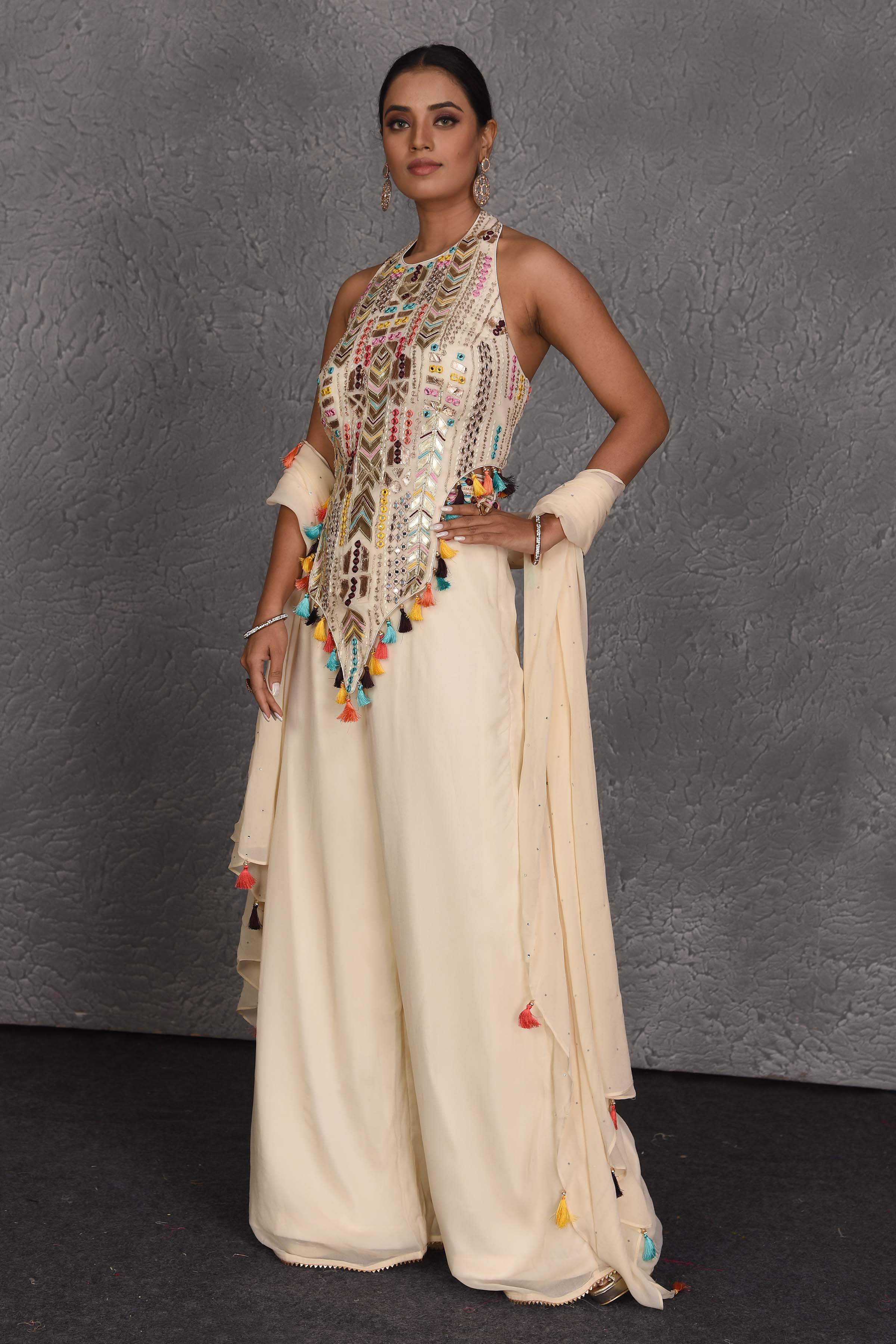 Shop stunning cream designer palazzo suit online in USA with dupatta. Flaunt your Indian style on festive occasions in stunning designer lehengas, Anarkali suit, sharara suits, designer gowns, designer sarees, embroidered sarees from Pure Elegance India fashion store in USA. -side