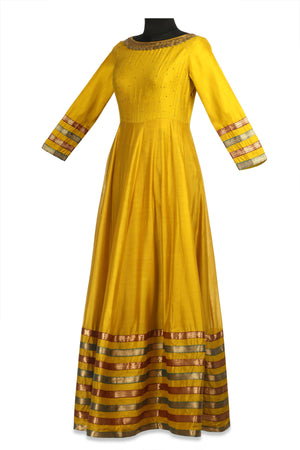 Shop beautiful yellow embroidered chanderi Anarkali online in USA with lace borders. Shine at weddings and special occasions with beautiful Indian designer Anarkali suits, traditional salwar suits, sharara suits, designer lehengas from Pure Elegance Indian clothing store in USA.-side