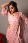 Shop this designer onion pink drape saree in satin organza and georgette fabric With Jaal ThreadWork. This saree comes in satin and organza fabric. The borders of the saree has sequin work on it. Complete the look with embroidered blouse showcasing floral and animal motifs especially around the neckline and on the backside. Shop this designer from Pure Elegance Indian clothing store in USA online now.-Full and close up view.