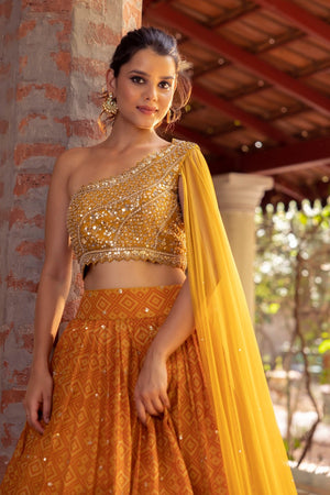 Buy Gold Net Asymmetric Sequin Embroidered One Shoulder Lehenga Set For  Women by Vvani by Vani Vats Online at Aza Fashions.