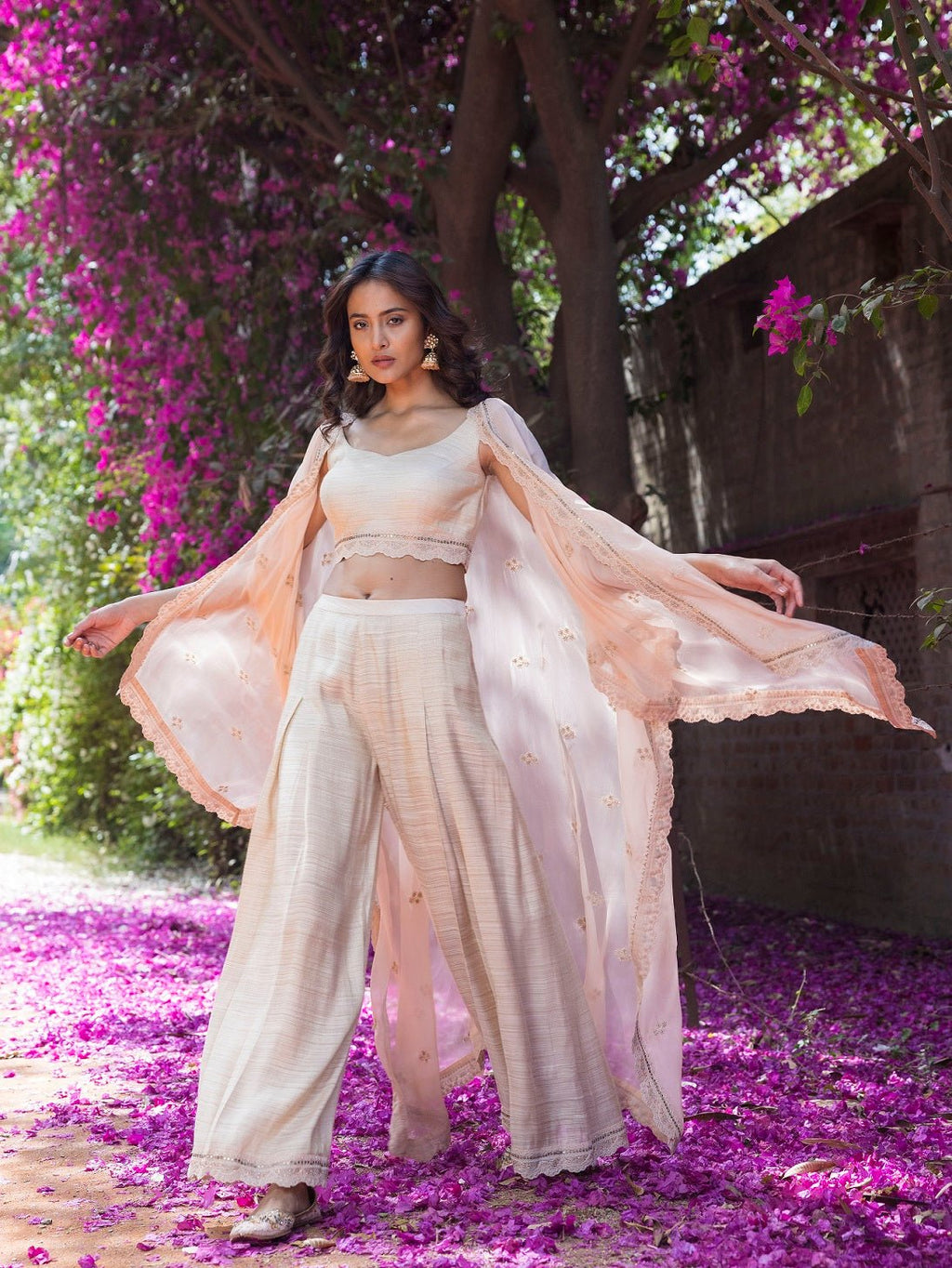 Shop beautiful peach crop top with palazzo and organza cape online in USA. Dazzle on weddings and special occasions with exquisite Indian designer dresses, sharara suits, Anarkali suits, wedding lehengas from Pure Elegance Indian fashion store in USA.-full view