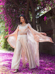 Shop beautiful peach crop top with palazzo and organza cape online in USA. Dazzle on weddings and special occasions with exquisite Indian designer dresses, sharara suits, Anarkali suits, wedding lehengas from Pure Elegance Indian fashion store in USA.-full view