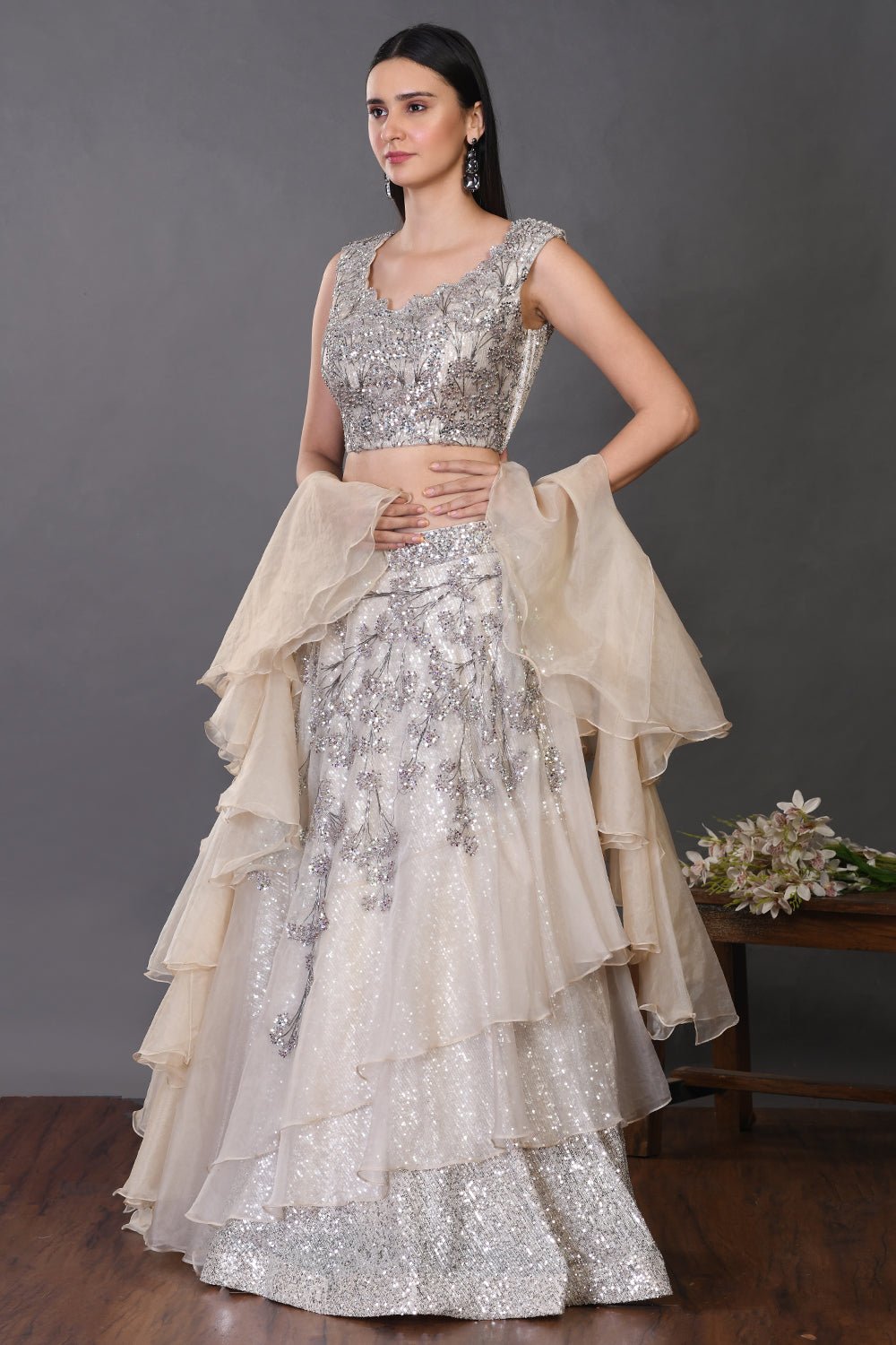 Shop beautiful off-white organza lehenga online in USA with ruffle dupatta. Get festive ready in beautiful designer Anarkali suits, designer lehenga, wedding gowns, sharara suits, designer sarees from Pure Elegance Indian fashion store in USA.-lehenga