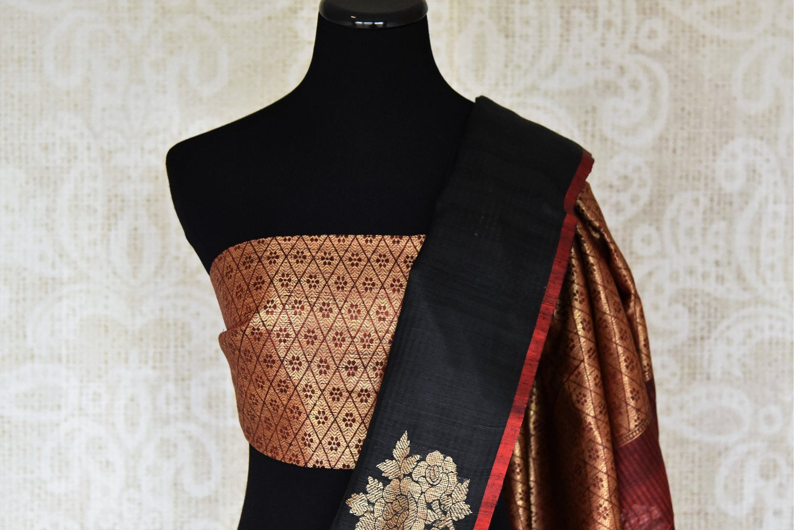 Shop black borderless tussar Benarasi saree online in USA with golden floral buta. Shine bright in best of Indian designer sarees from Pure Elegance Indian fashion store in USA on special occasions. Choose from a splendid variety of Banarasi sarees, pure handwoven saris. Shop online.-blouse pallu