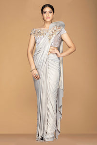 Buy metallic grey designer sari online in USA with placement embroidery pallu and embroidered saree blouse. Champion ethnic fashion with a splendid collection of designer sarees, embroidered sarees with blouse, weddings sarees from Pure Elegance Indian fashion store in USA.-full view