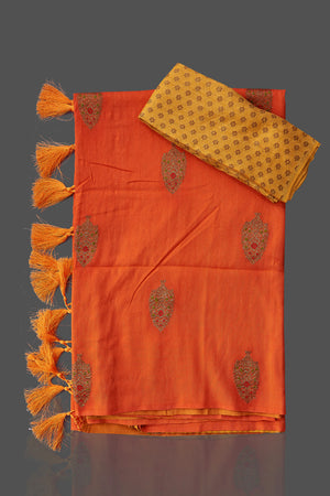 Shop stunning orange and yellow borderless muga Benarasi saree online in USA with antique zari buta. Shop beautiful Banarasi sarees, georgette sarees, pure muga silk sarees in USA from Pure Elegance Indian fashion boutique in USA. Get spoiled for choices with a splendid variety of Indian saris to choose from! Shop now.-details