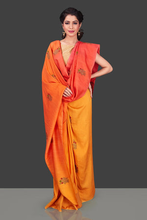 Shop stunning orange and yellow borderless muga Benarasi saree online in USA with antique zari buta. Shop beautiful Banarasi sarees, georgette sarees, pure muga silk sarees in USA from Pure Elegance Indian fashion boutique in USA. Get spoiled for choices with a splendid variety of Indian saris to choose from! Shop now.-front