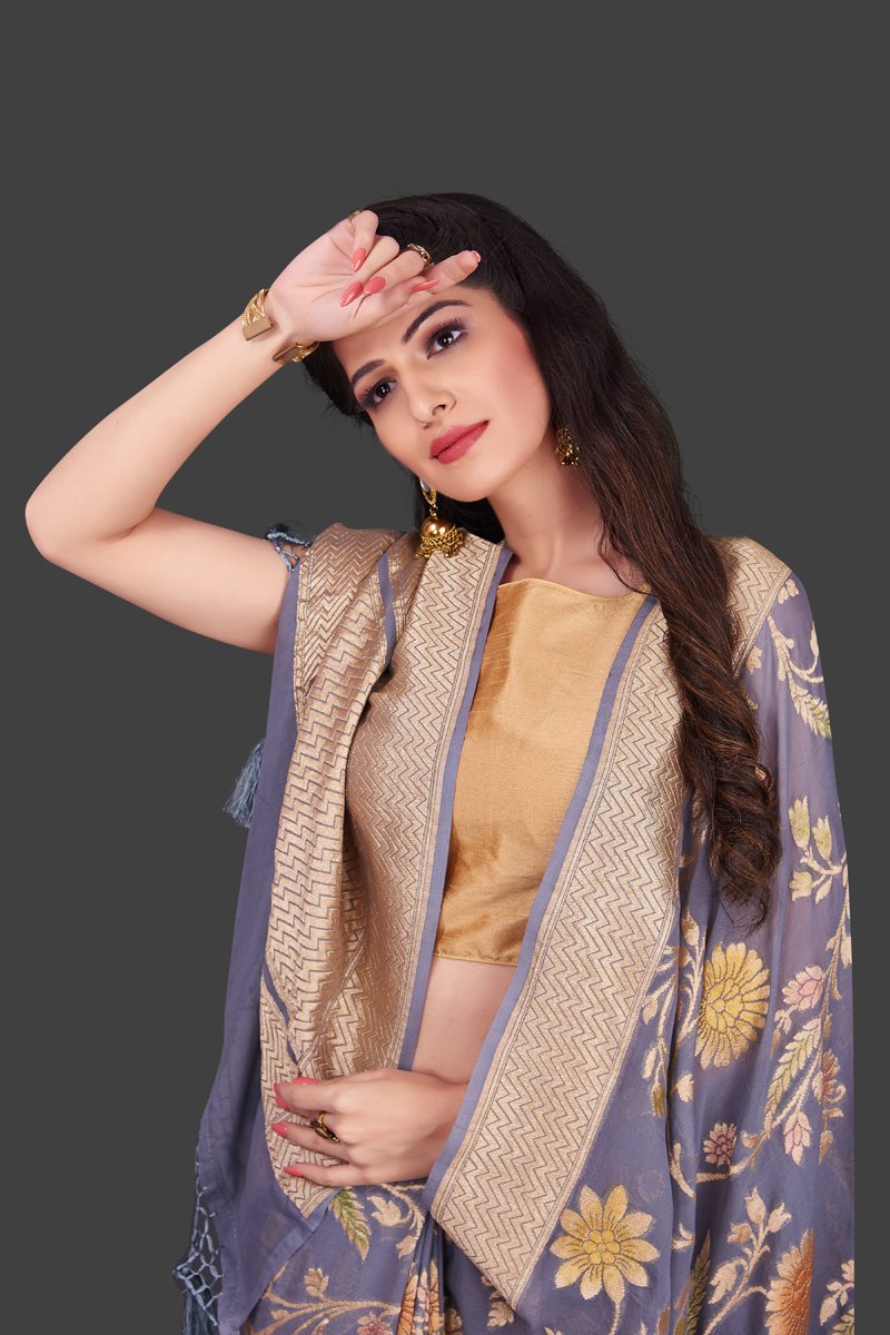 Shop grey georgette Benarasi saree online in USA with floral zari jaal. Shop beautiful Banarasi georgette sarees, tussar sarees, pure muga silk sarees in USA from Pure Elegance Indian fashion boutique in USA. Get spoiled for choices with a splendid variety of Indian sarees to choose from! Shop now.-closeup