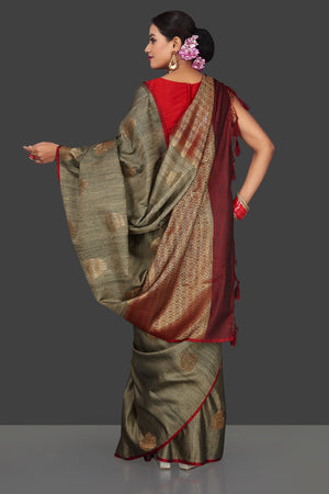 Buy elegant striped grey borderless tussar Banarasi saree online in USA with antique zari buta. Garner compliments on weddings and special occasions with exquisite Banarasi saris, handwoven silk sarees, tussar sarees from Pure Elegance Indian fashion store in USA.-back