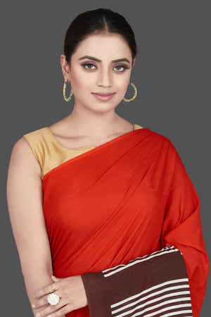 Shop stunning red and brown striped modal silk sari online in USA. Be the highlight of the occasion in beautiful pure silk saree, designer saris, handloom sarees, embroidered sarees, Kanchipuram sarees, Banarasi saris from Pure Elegance Indian saree store in USA.-closeup