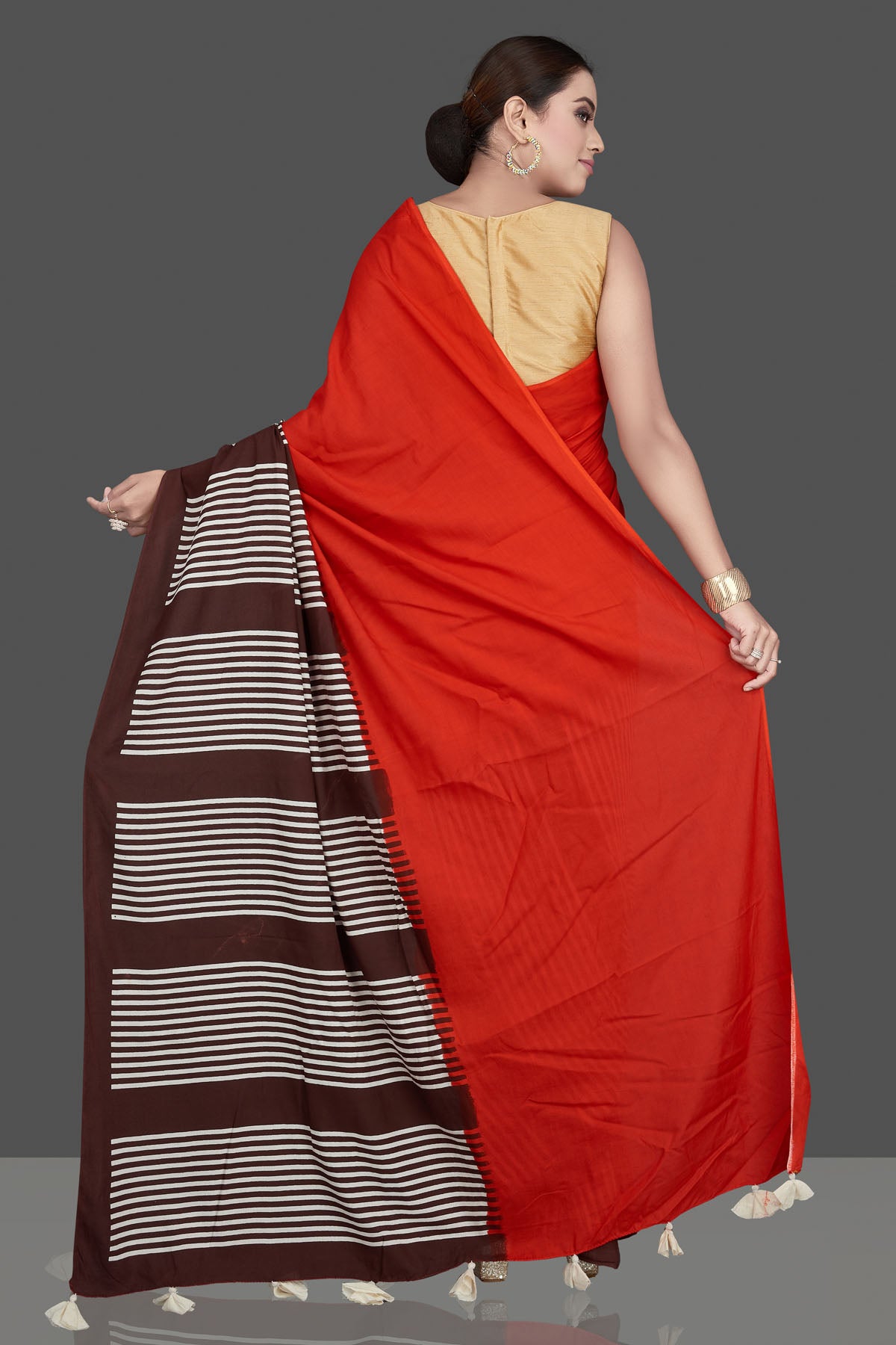 Shop stunning red and brown striped modal silk sari online in USA. Be the highlight of the occasion in beautiful pure silk saree, designer saris, handloom sarees, embroidered sarees, Kanchipuram sarees, Banarasi saris from Pure Elegance Indian saree store in USA.-back