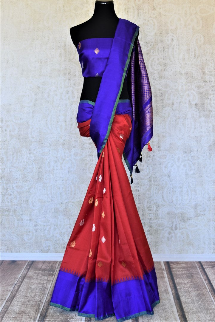 Buy stunning red Gadhwal silk saree online in USA with blue border and blue zari pallu. Look attractive on special occasions in the beautiful silk sarees, designer saris, embroidered sarees, handwoven saris from Pure Elegance Indian fashion store in USA.-full view