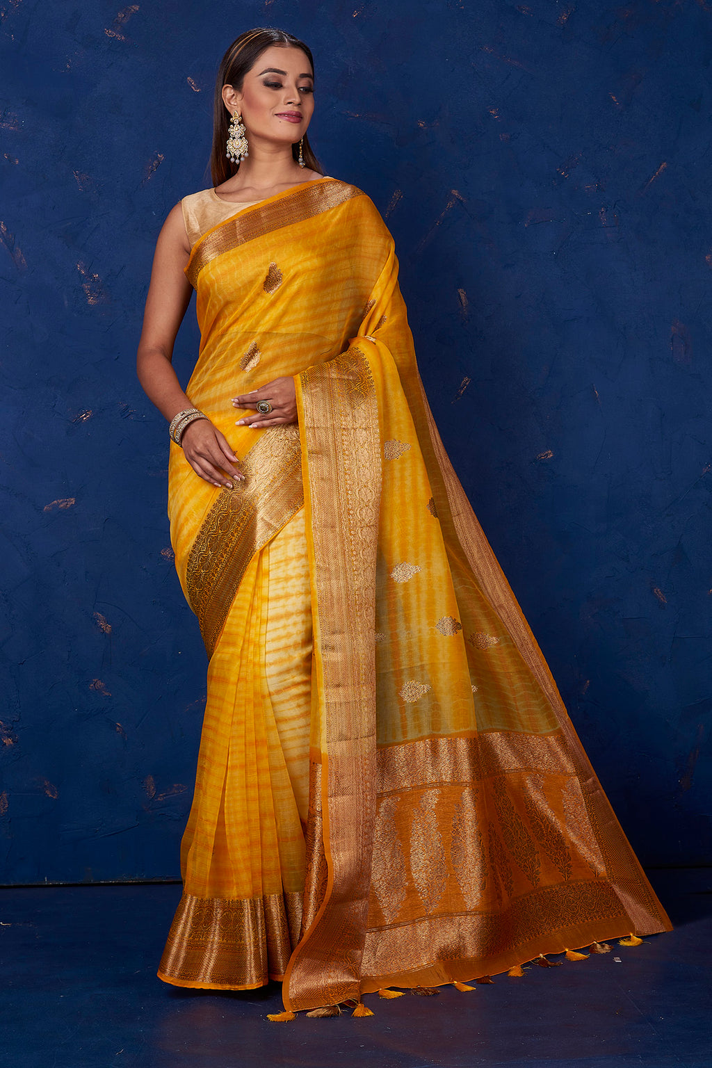 Shop gorgeous mustard Kora Banarasi saree online in USA with zari border. Keep your ethnic wardrobe up to date with latest designer sarees, pure silk sarees, handwoven sarees, tussar silk sarees, embroidered sarees from Pure Elegance Indian saree store in USA.-full view