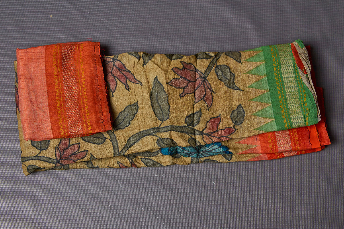 Buy beautiful pen Kalamkari saree online in USA with orange and green border. Keep your ethnic wardrobe up to date with latest designer sarees, pure silk sarees, Kanchipuram silk sarees, handwoven sarees, tussar silk sarees, embroidered sarees from Pure Elegance Indian saree store in USA.-blouse