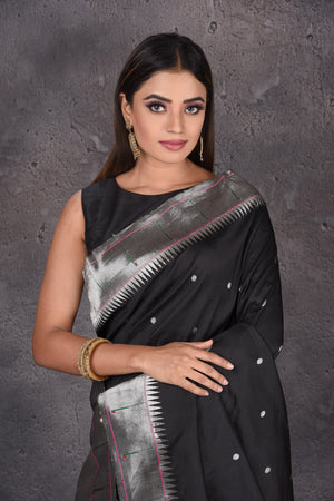 Shop black Paithani silk saree online in USA with single muniya zari border. Keep your ethnic wardrobe up to date with latest designer sarees, pure silk sarees, handwoven sarees, tussar silk sarees, embroidered saris, Paithani sarees from Pure Elegance Indian saree store in USA.-closeup