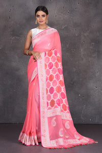 Buy beautiful pastel pink Banarasi silk saree online in USA with silver zari border. Keep your ethnic wardrobe up to date with latest designer saris, pure silk sarees, handwoven silk sarees, tussar silk sarees, Benarasi sarees, embroidered sarees from Pure Elegance Indian saree store in USA.-full view