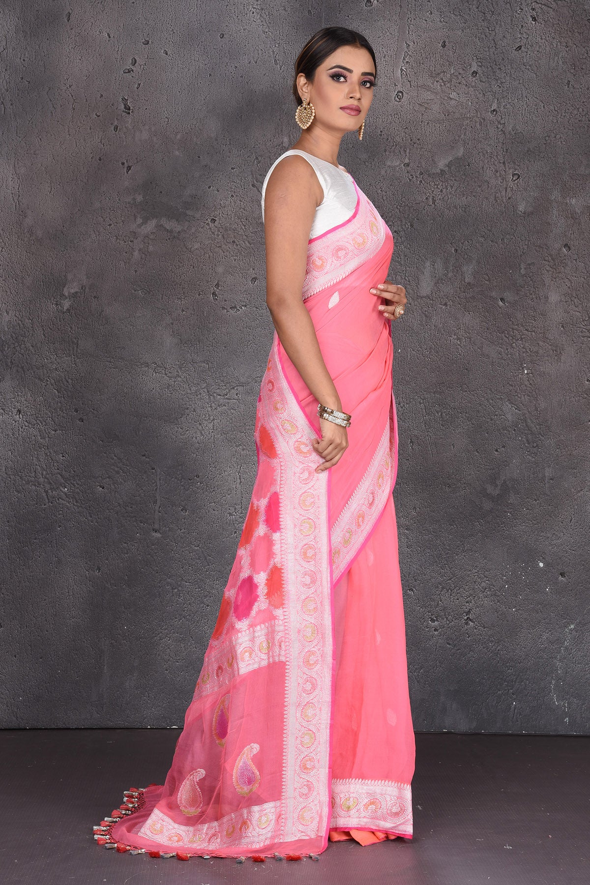 Buy beautiful pastel pink Banarasi silk saree online in USA with silver zari border. Keep your ethnic wardrobe up to date with latest designer saris, pure silk sarees, handwoven silk sarees, tussar silk sarees, Benarasi sarees, embroidered sarees from Pure Elegance Indian saree store in USA.-side