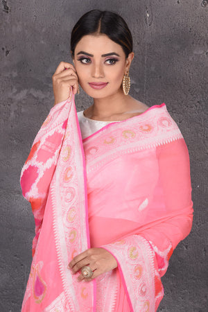 Buy beautiful pastel pink Banarasi silk saree online in USA with silver zari border. Keep your ethnic wardrobe up to date with latest designer saris, pure silk sarees, handwoven silk sarees, tussar silk sarees, Benarasi sarees, embroidered sarees from Pure Elegance Indian saree store in USA.-closeup