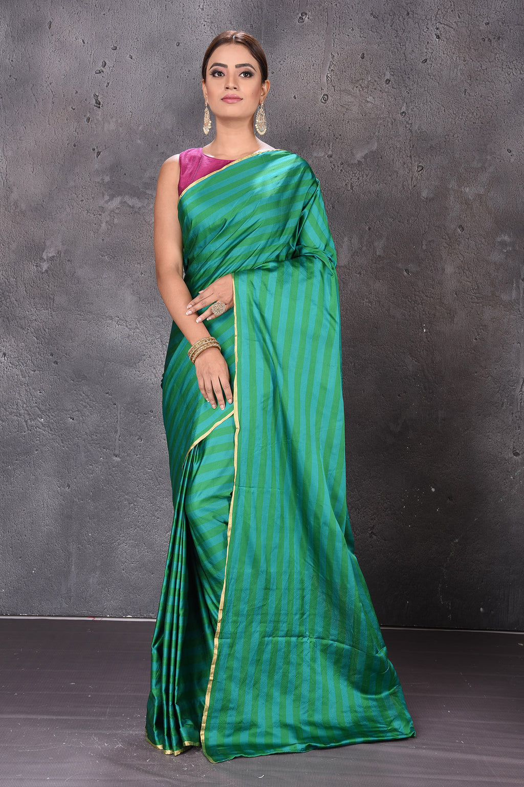 Buy stunning dark and light green stripes Mashru silk saree online in USA. Keep your ethnic wardrobe up to date with latest designer sarees, pure silk sarees, handwoven sarees, tussar silk sarees, embroidered sarees from Pure Elegance Indian saree store in USA.-full view