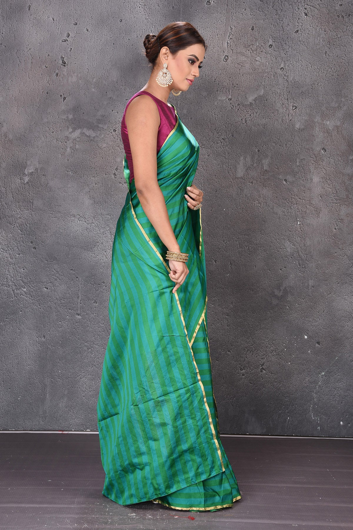 Buy stunning dark and light green stripes Mashru silk saree online in USA. Keep your ethnic wardrobe up to date with latest designer sarees, pure silk sarees, handwoven sarees, tussar silk sarees, embroidered sarees from Pure Elegance Indian saree store in USA.-side